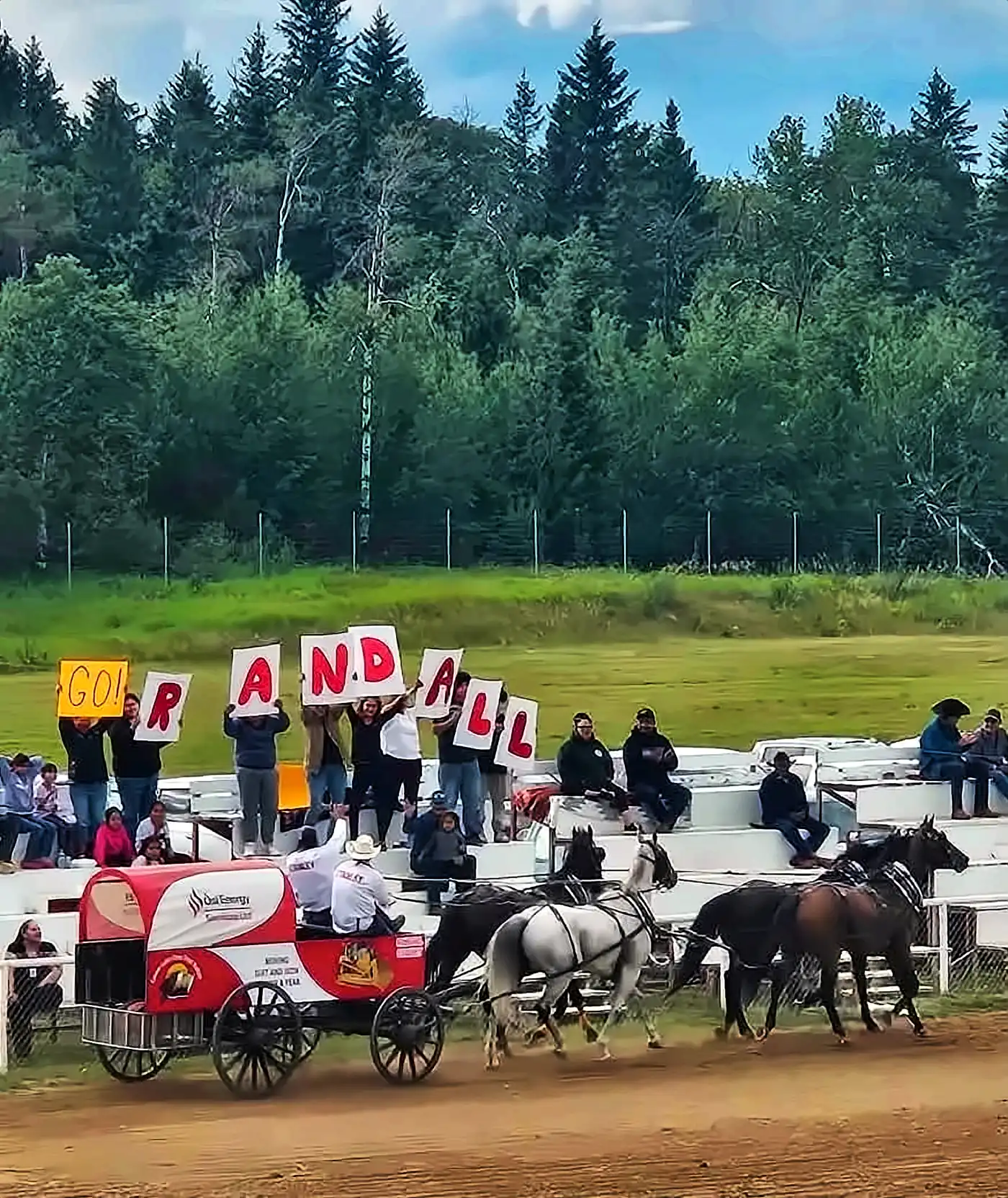 Randall Stanley's Ôsi Energy chuckwagon racing past cheering fans